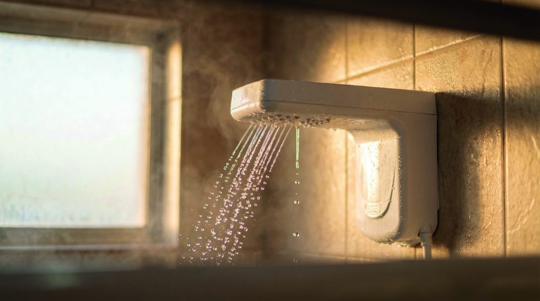 Electric Shower Head with Running Water in Bathroom Close Up